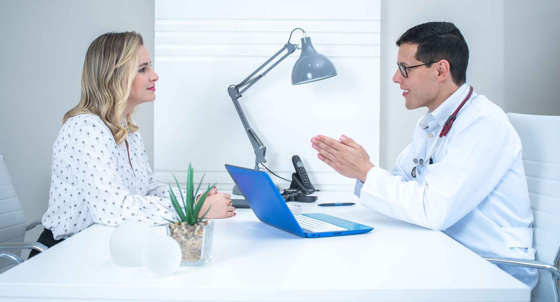 Doctor speaking with patient, discussing treatment details