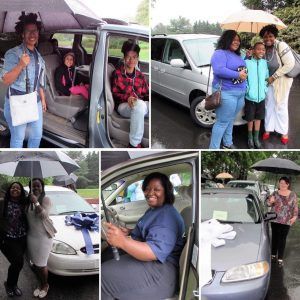 People celebrating a car purchase. Smiling, posing with the vehicle, some under umbrellas in the rain.