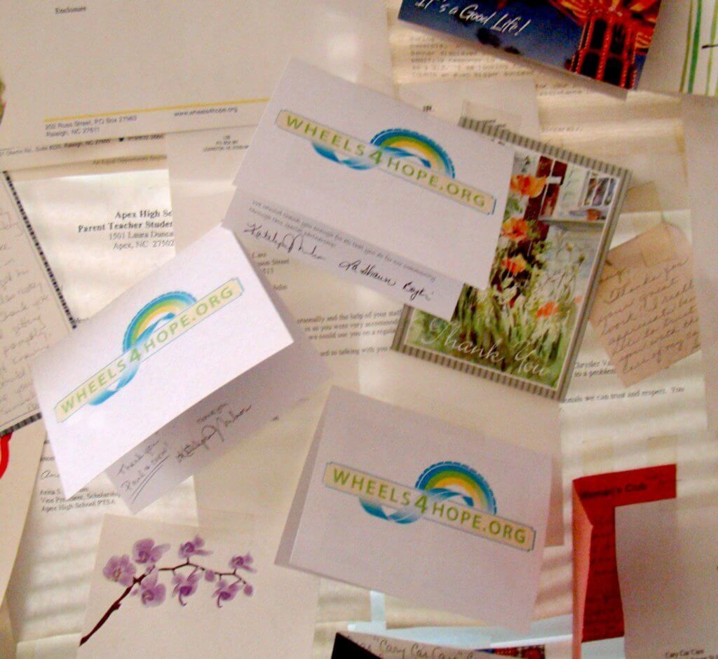 Cards and letters on a surface, featuring