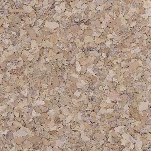 A close up of a pile of wood chips on a table.