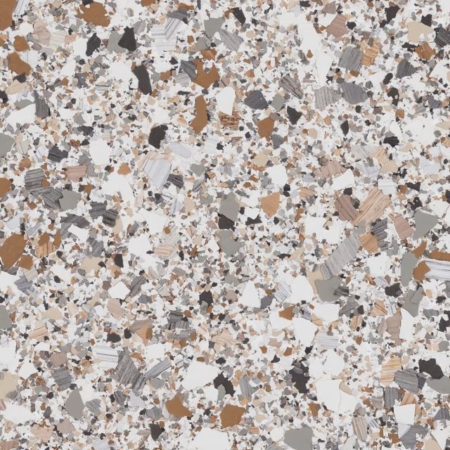 A close up of a granite counter top with a lot of small rocks on it.