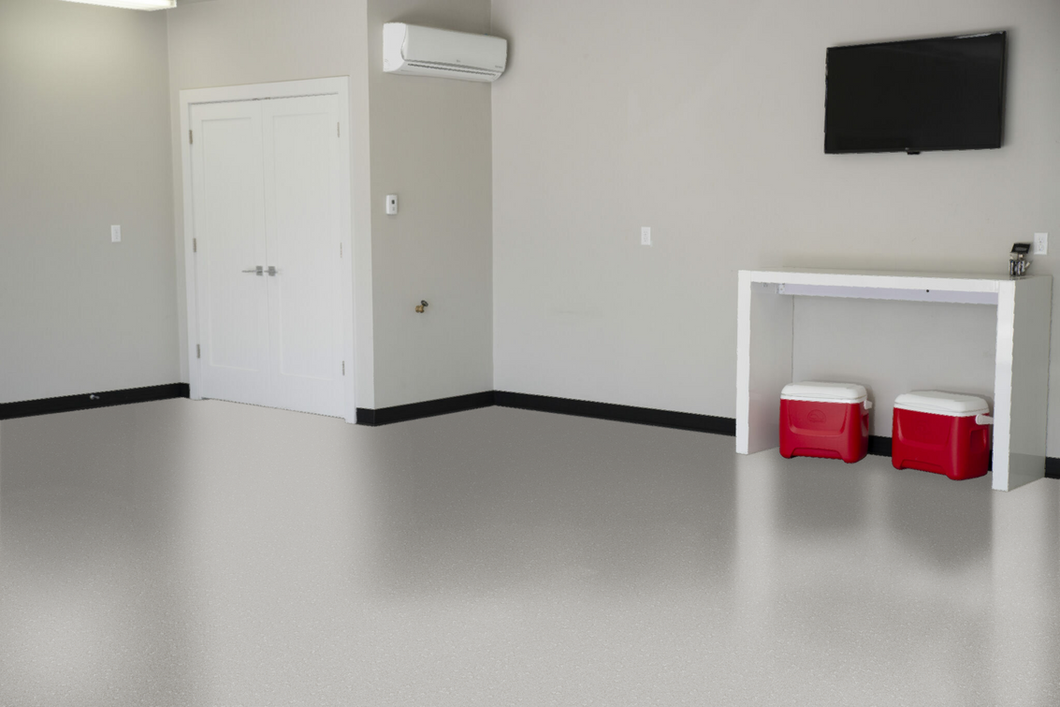 An empty room with two red coolers and a tv on the wall.