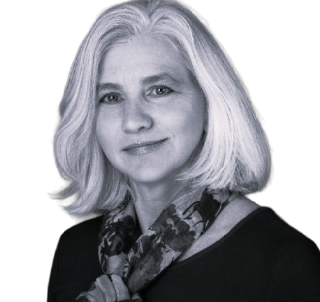 Black-and-white portrait of a smiling woman with shoulder-length light hair and a patterned scarf