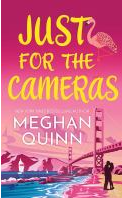 Book Title: "Just For The Cameras" By Quinn, Meghan. The background is a pink skyline.
