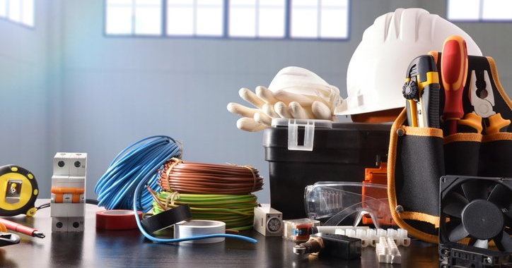 Composition with tools and industrial material with industrial ship background