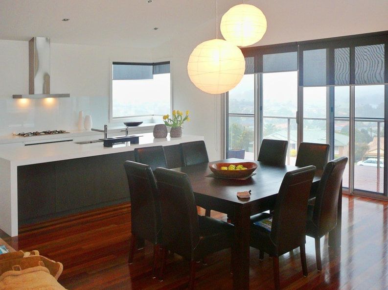 A Dining Room Table With A Bowl Of Fruit On It — Greg Keft Electrical in Bonny Hills, NSW