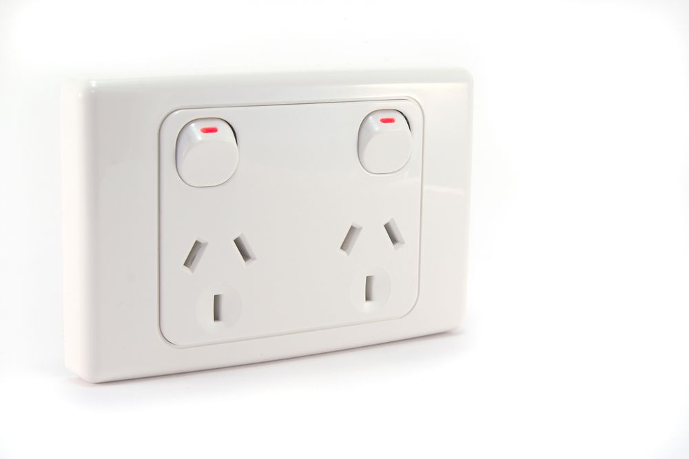 A white electrical outlet with two switches on a white background — Greg Keft Electrical in Port Macquarie, NSW