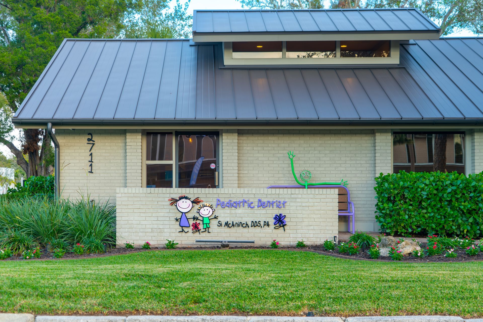 A building with a sign that says pediatric dentist on it