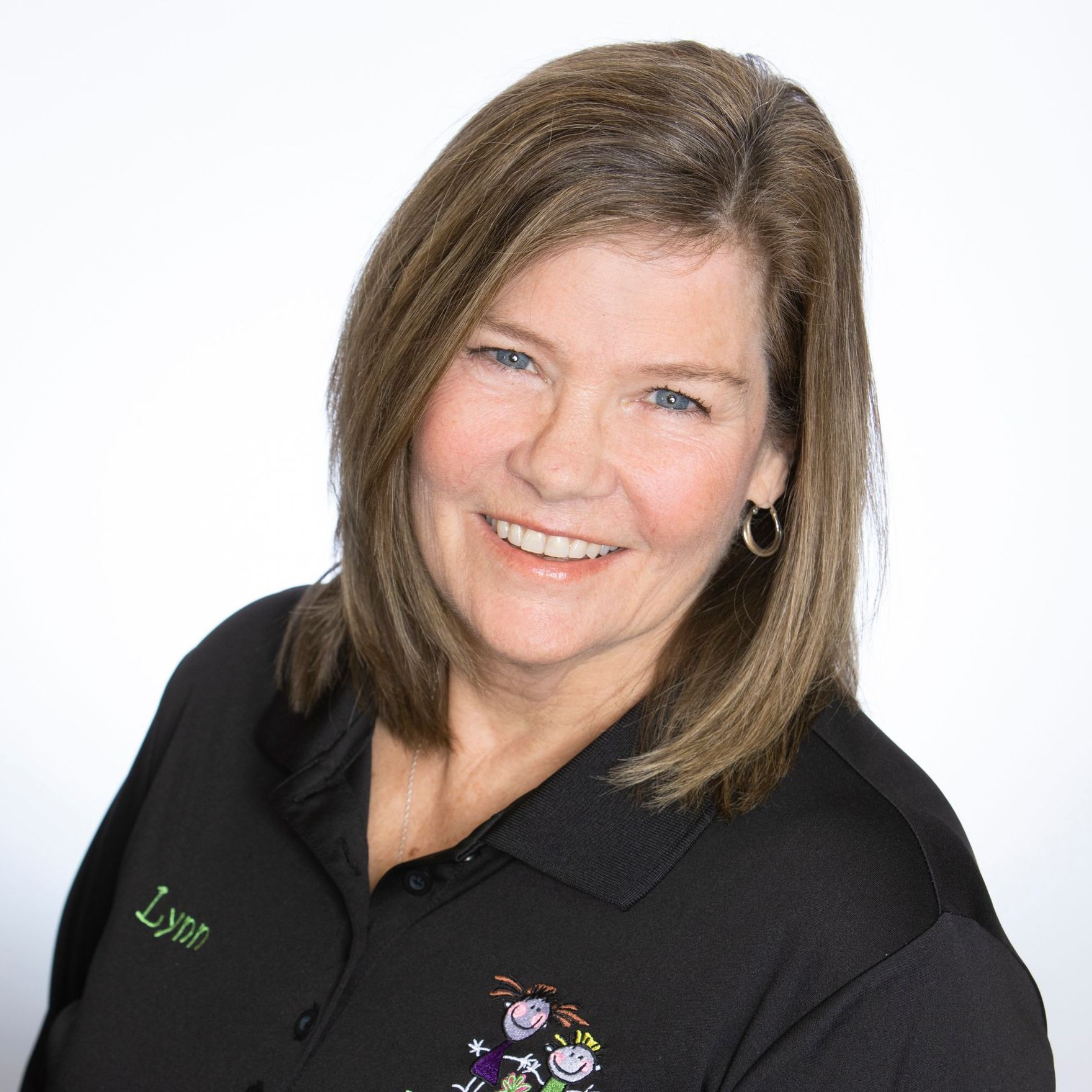A woman wearing a black shirt with the name lynn on it