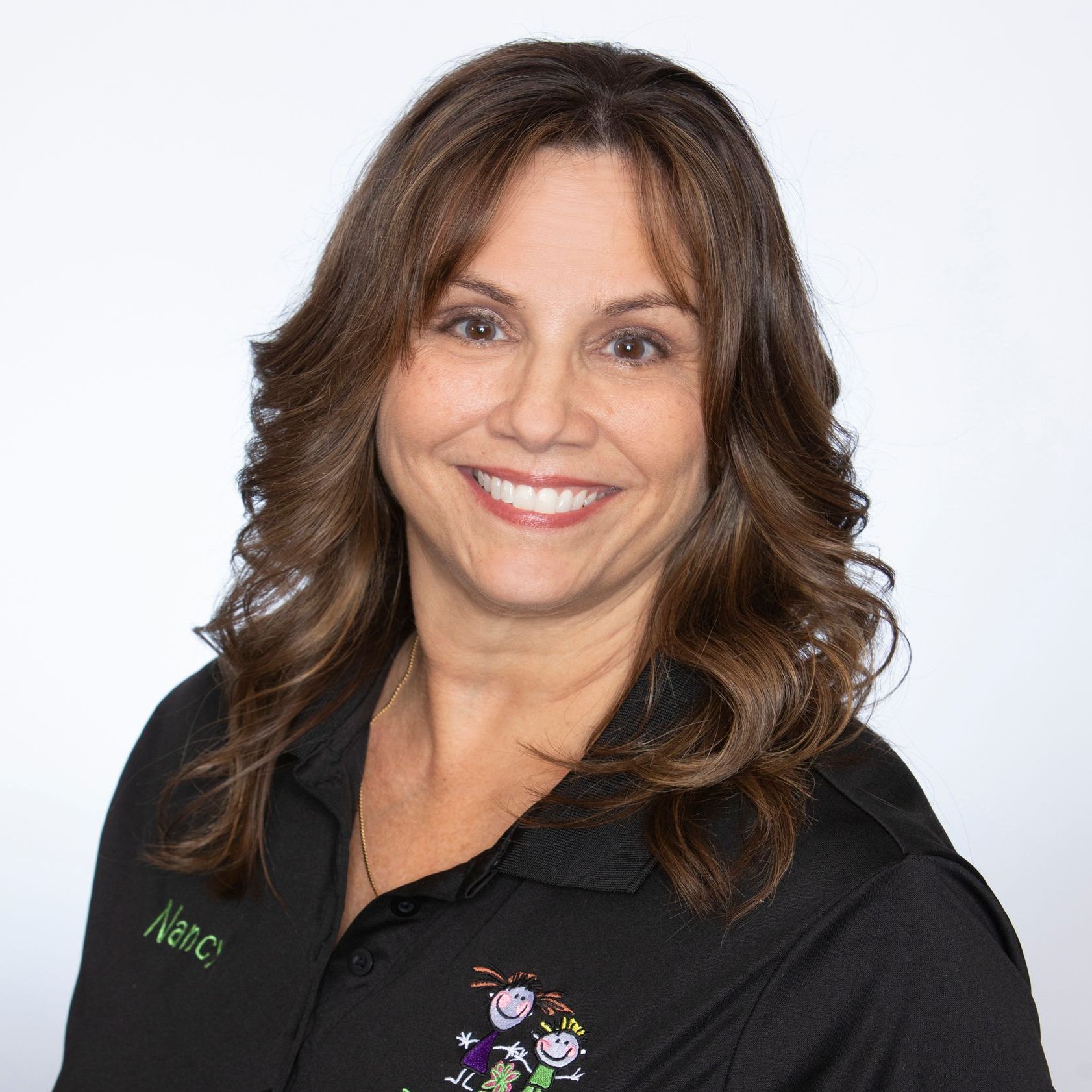 A woman wearing a black shirt that says nabc on it