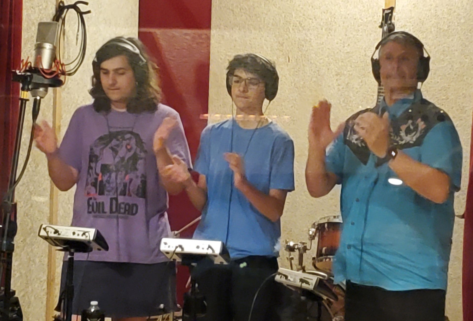 Tom Weber and his two children recording vocals