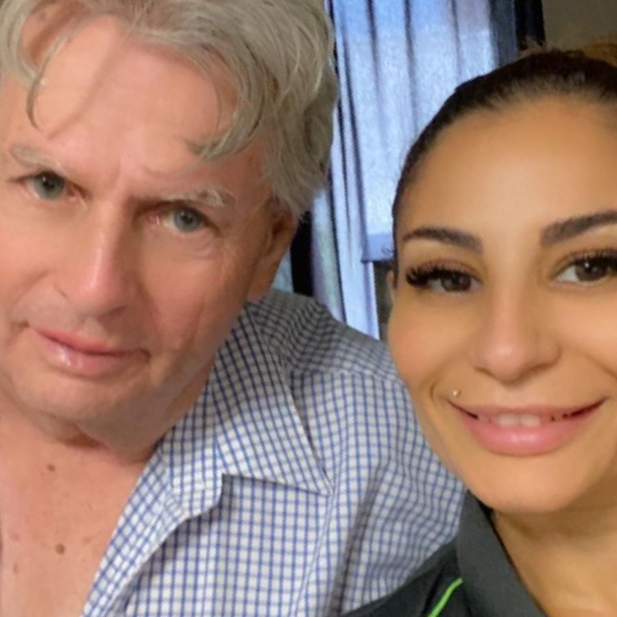 A man and a woman are posing for a picture together