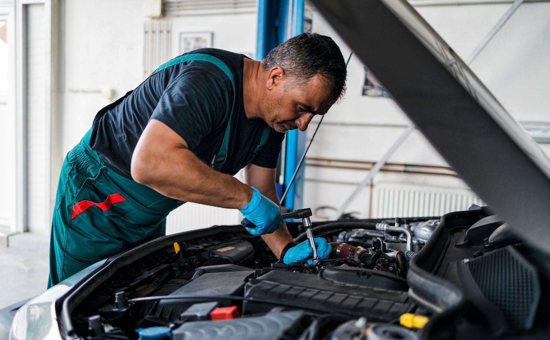 Man Fixing A Car | Brainard, NE | CTF Service Inc Man Fixing A Car | Brainard, NE | CTF Service Inc