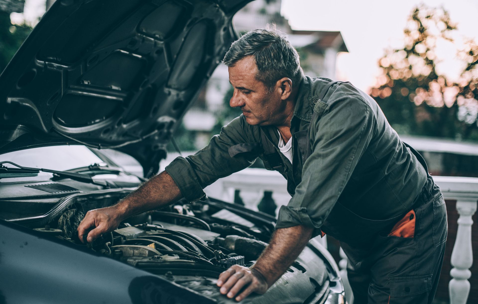 Man Repairing Car Issue | Brainard, NE | CTF Service Inc Man Repairing Car Issue | Brainard, NE | CTF Service Inc