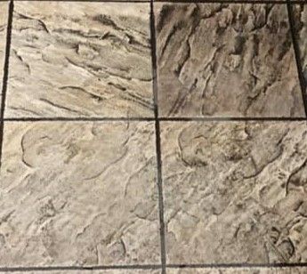 A close up of a tiled floor with a marble texture.