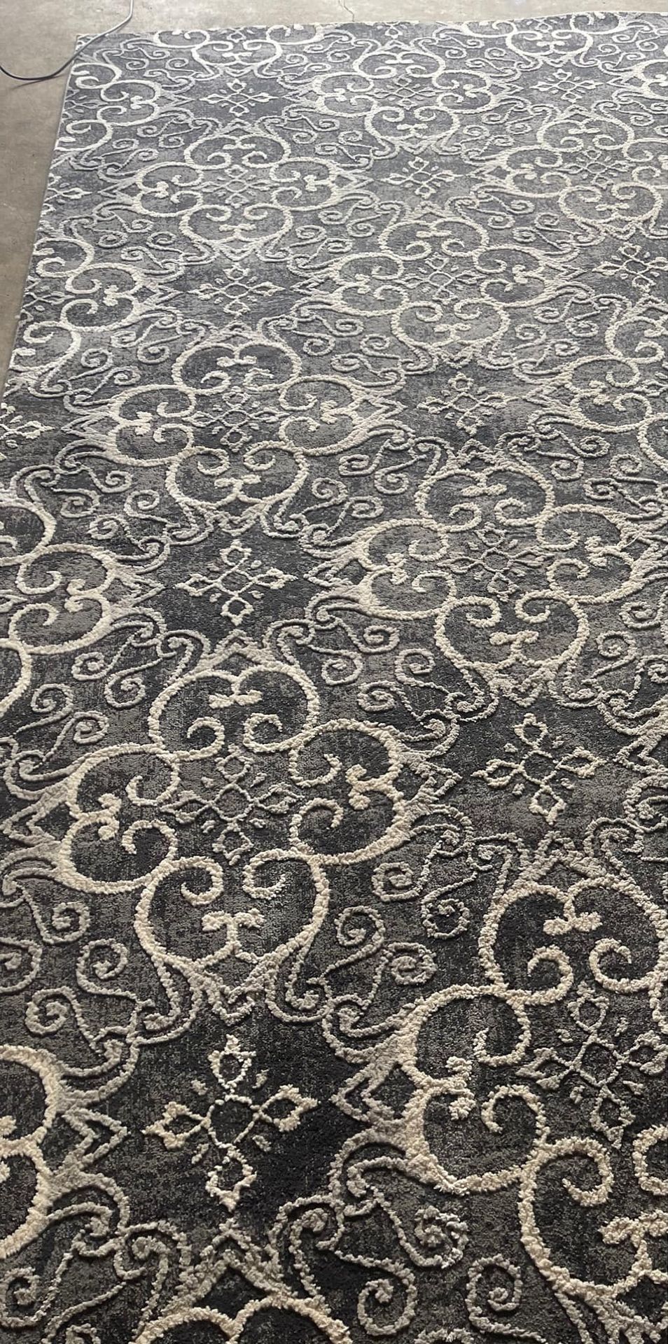 A close up of a rug with a pattern on it.
