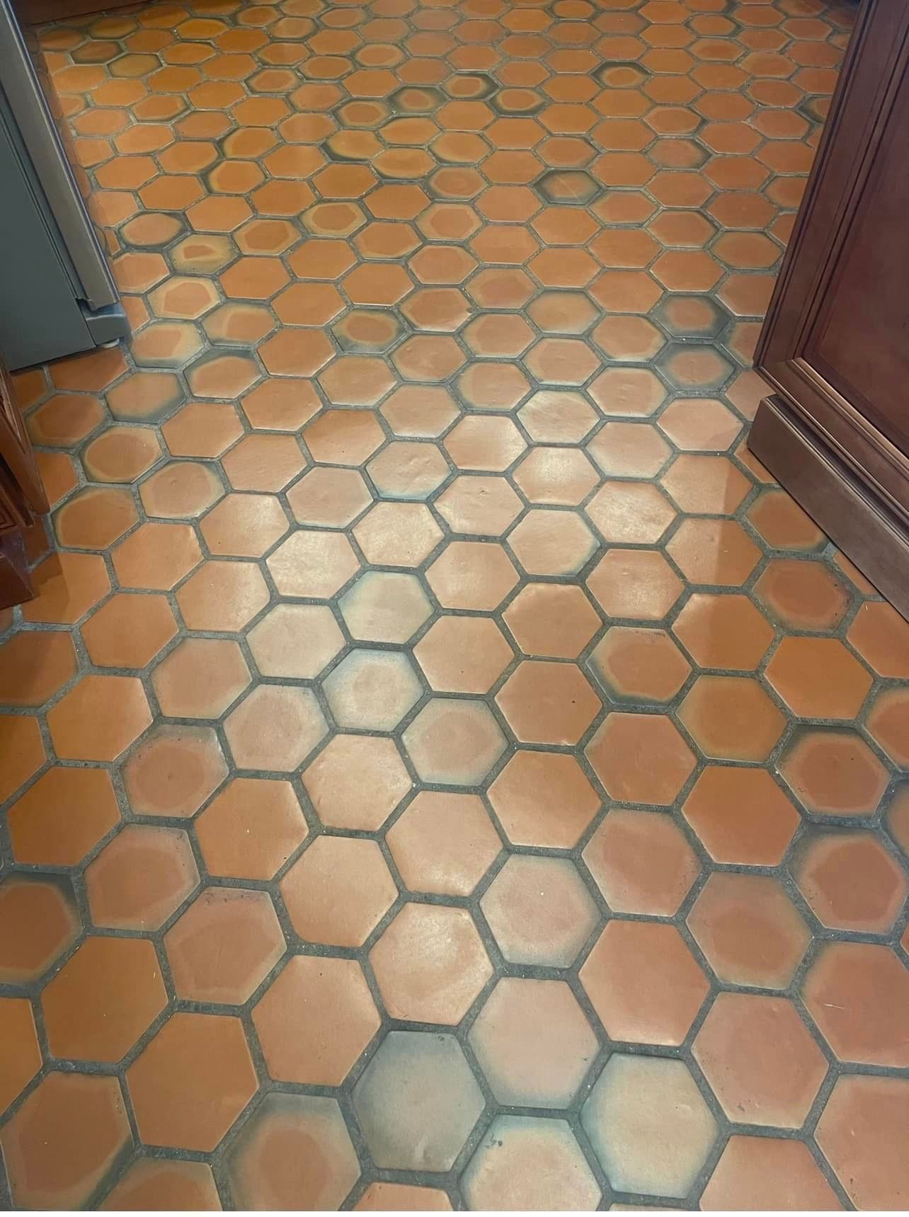 A kitchen floor with a honeycomb pattern on it
