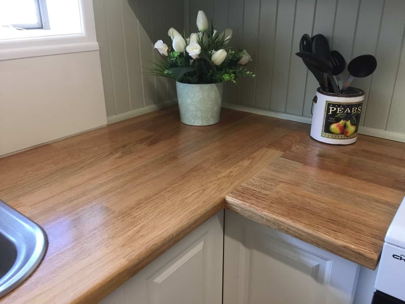 A Kitchen Counter with A Potted Plant and Utensils on It — Payless Timbers in Tolga, QLD