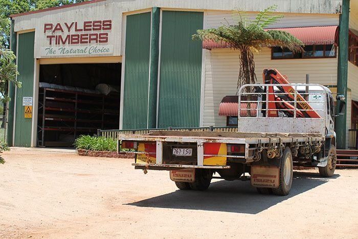 Truck is Parked in Front of a Building That Says Payless Timbers — Payless Timbers in Tolga, QLD