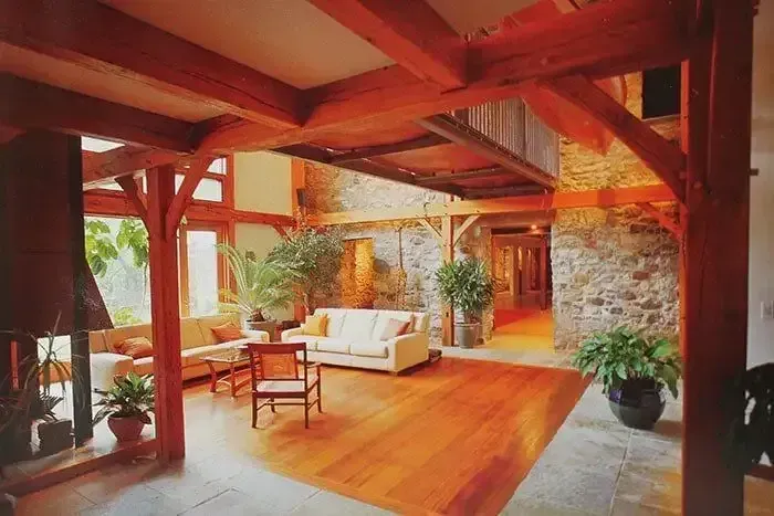 Living Room With a Couch and Chairs and a Fireplace — Payless Timbers in Cape York, QLD
