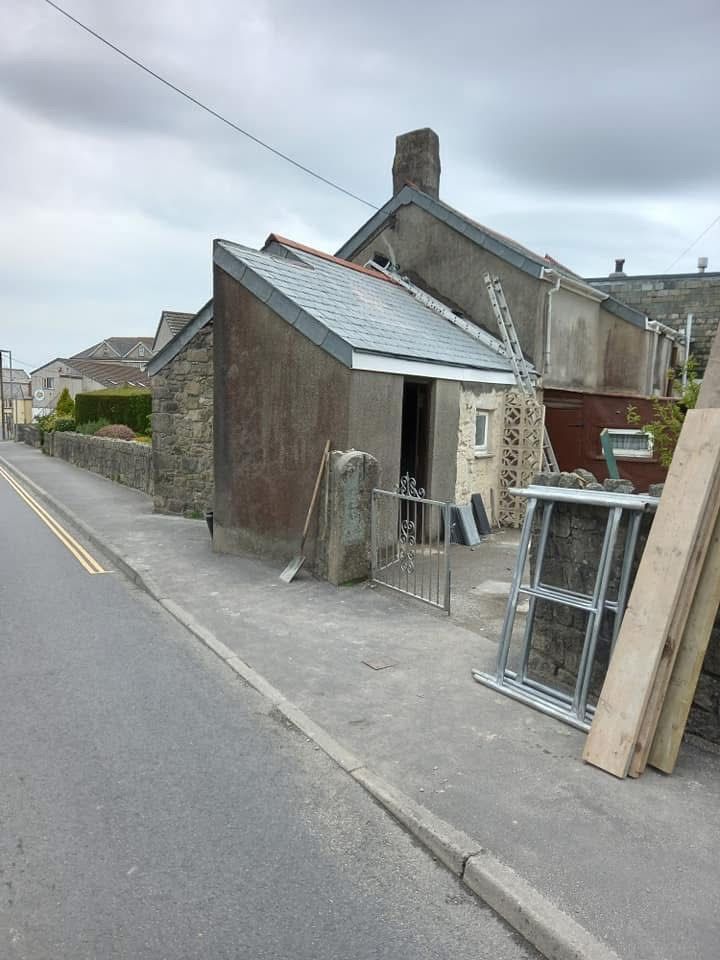 Wider view of a property with grey slate roofing