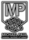 MPC logo with stylized globe and the words “MICHAEL PAUL CRIMINAL DEFENSE ATTORNEY”