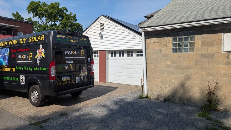 A black van labeled 