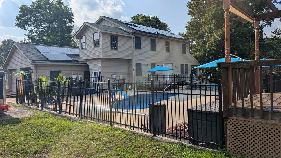 Two-story house with a pool in the backyard.