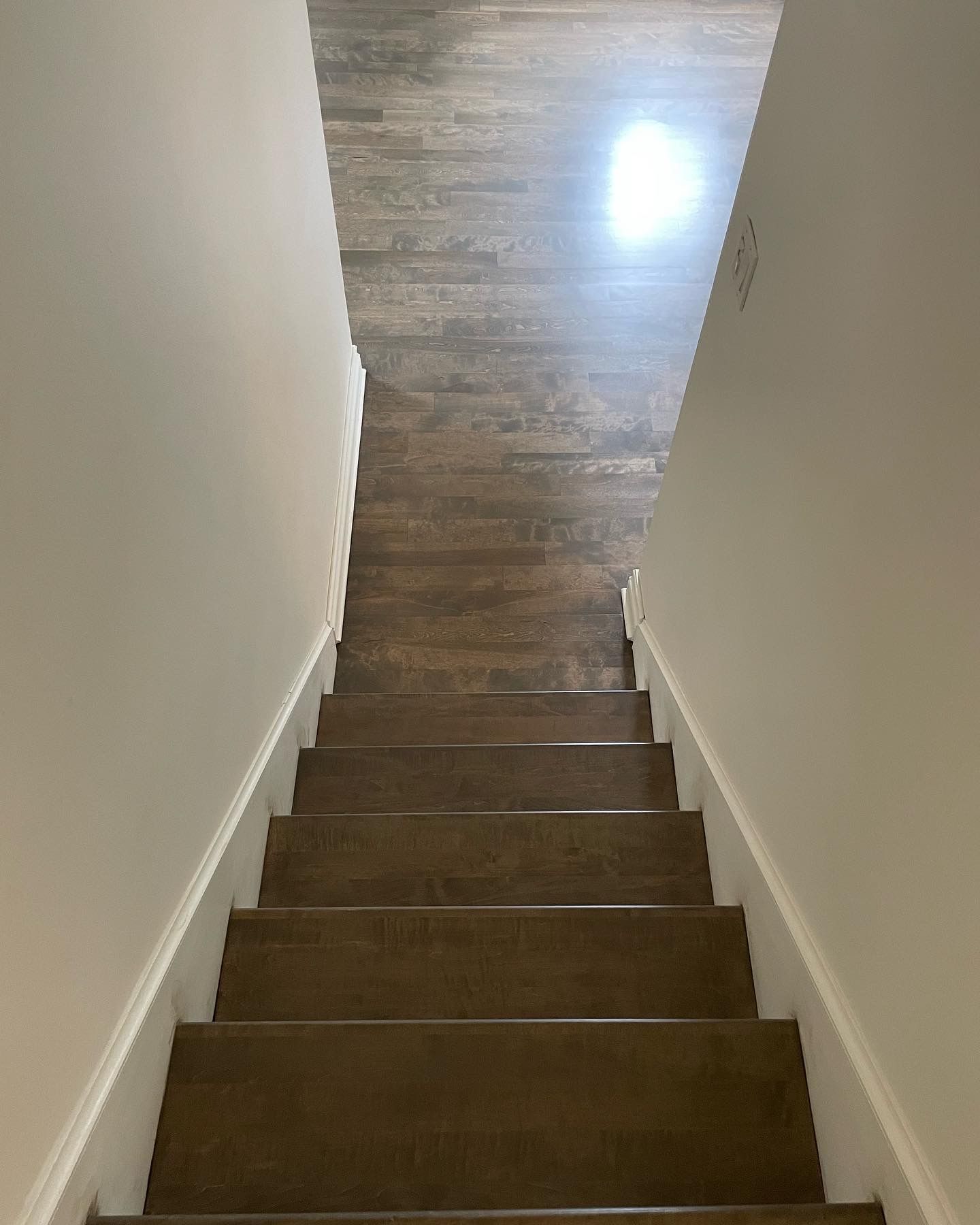 A set of stairs leading up to the second floor of a house.