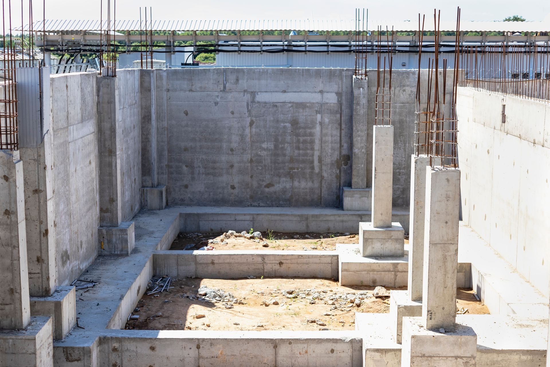 A concrete foundation is being built for a house.