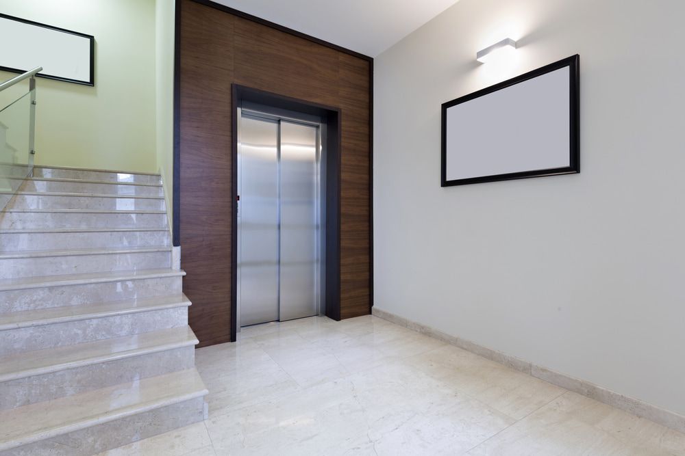 A Hallway With Stairs And An Elevator In A Building — Master Lifts Cairns in Atherton Tablelands, QLD