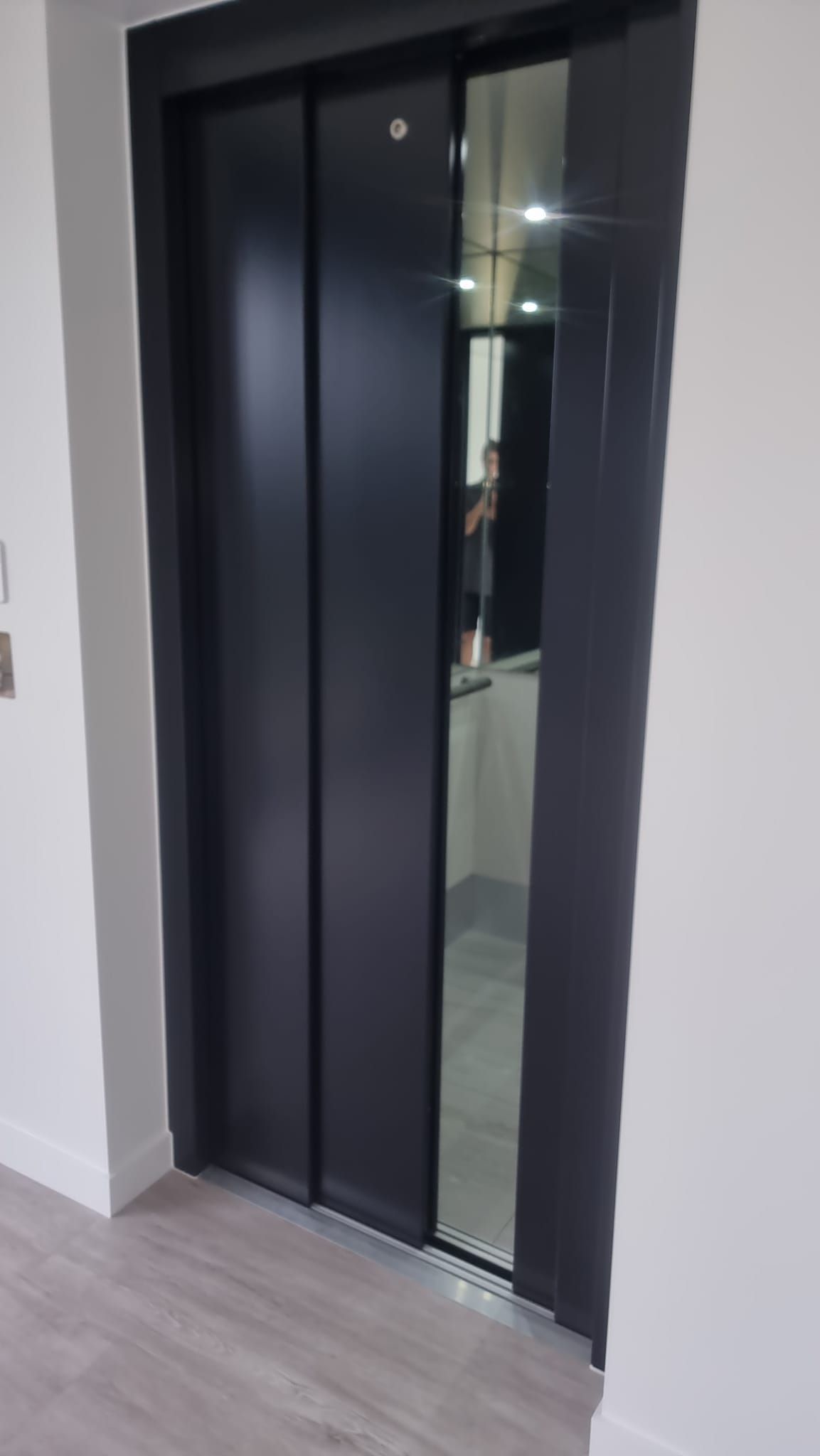 A Black Elevator with A Mirror on The Door — Master Lifts Cairns in Cairns, QLD