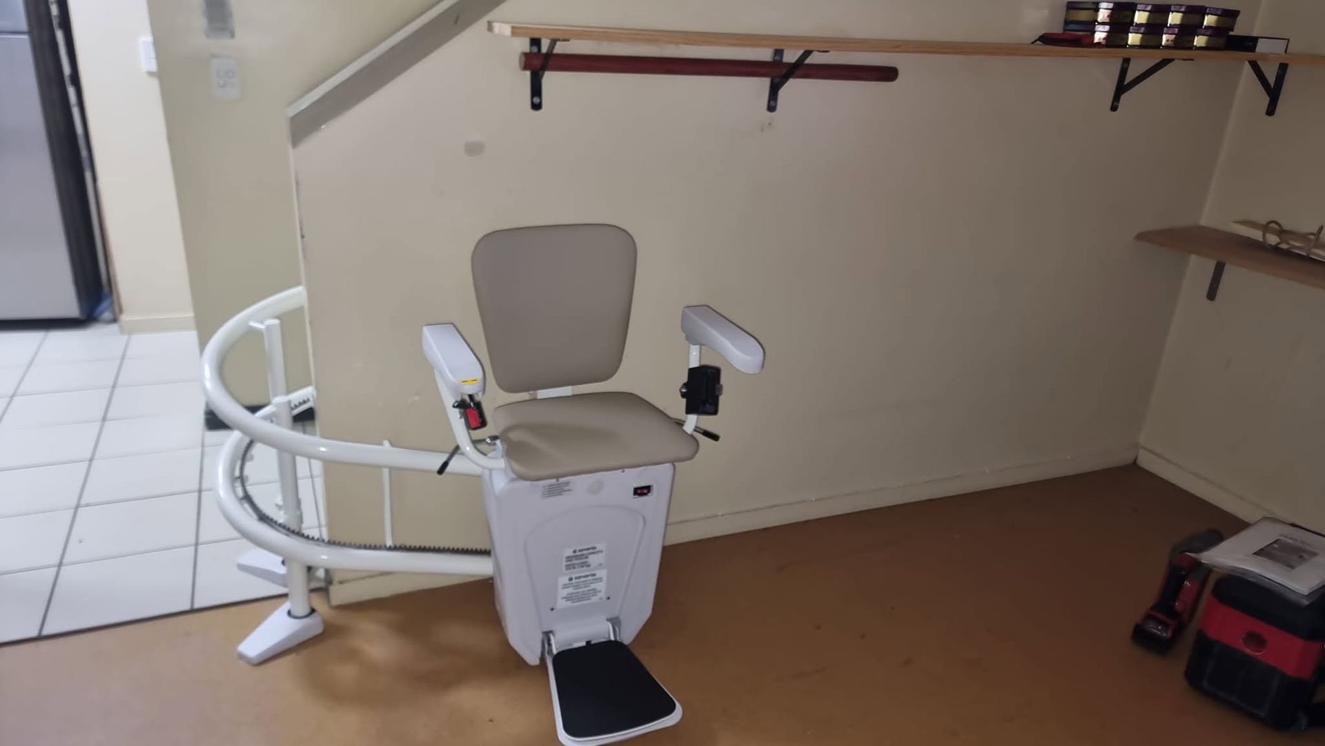 Chair Lift In Cairns On Curved Indoor Stairs With Padded Seat For Safe Home Access And Comfort