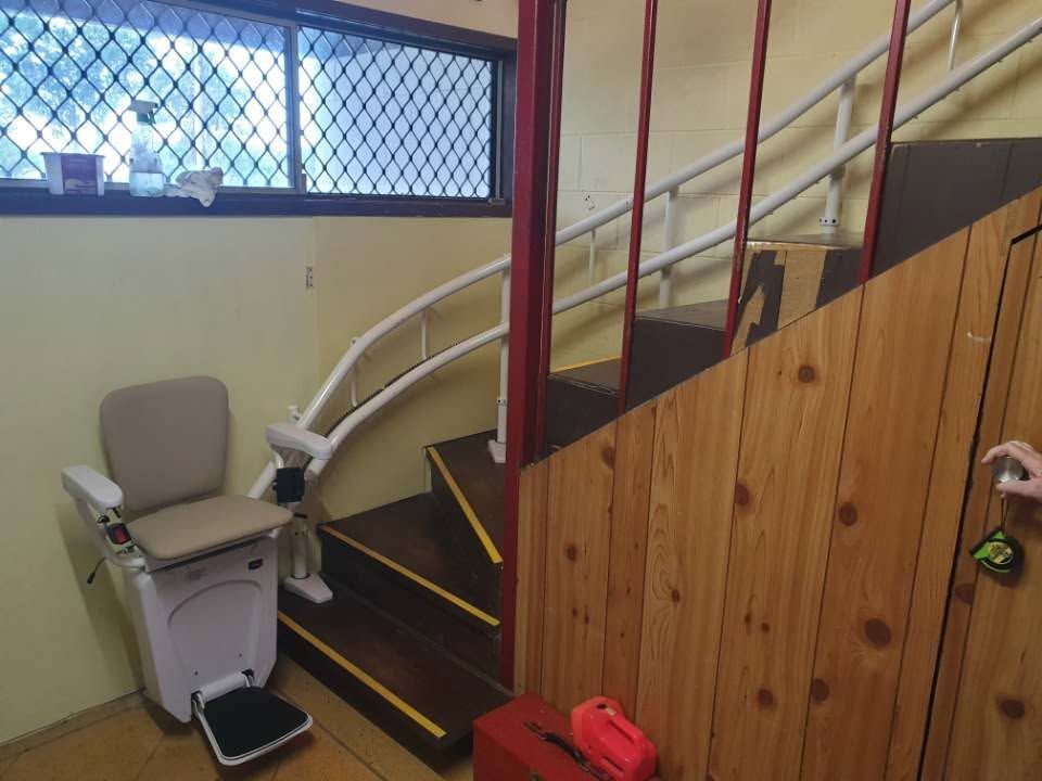 Chair Lift In Cairns On Curved Indoor Stairs With Secure Seat For Safe, Easy Home Access Always