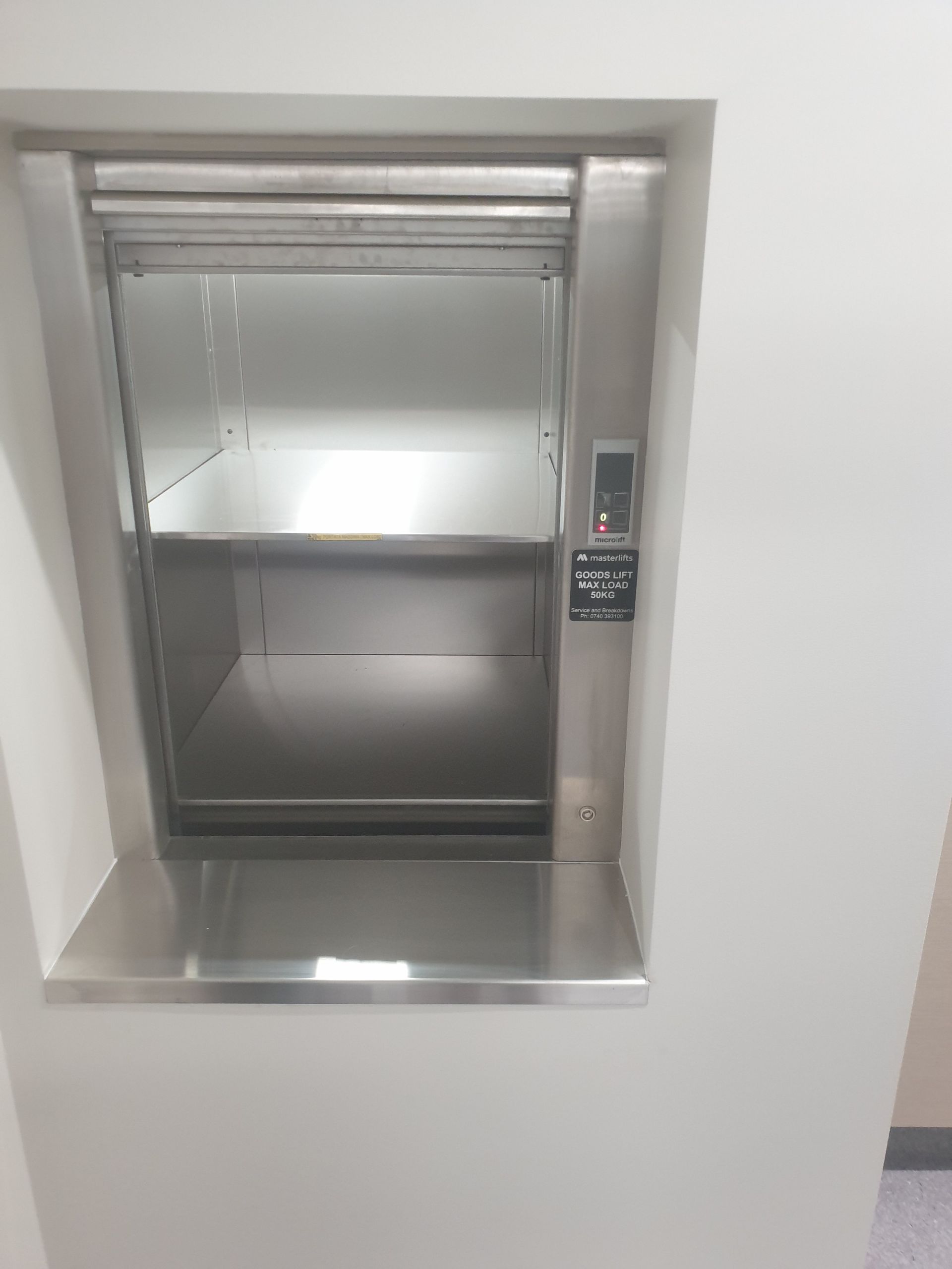 There Is a Stainless Steel Elevator in The Wall — Master Lifts Cairns in Cairns, QLD