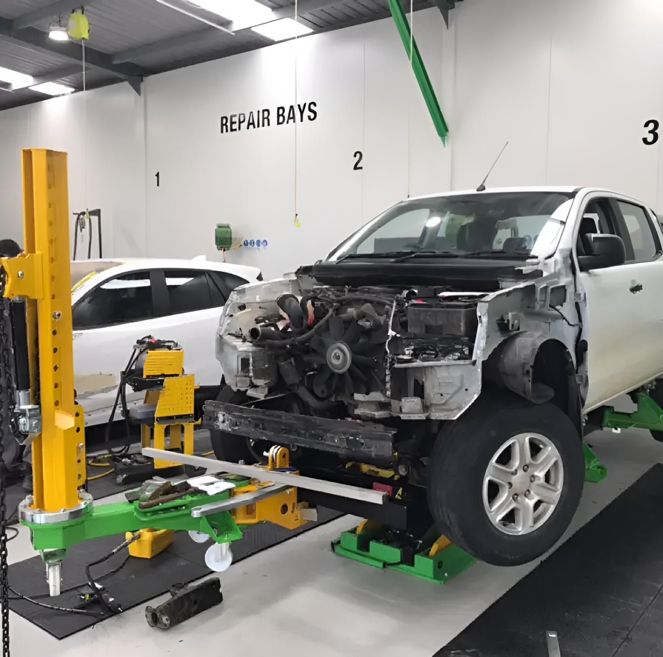 A Car is Being Repaired in the Repair Bays — A & J Auto Body Repairs In Hunter Valley, NSW