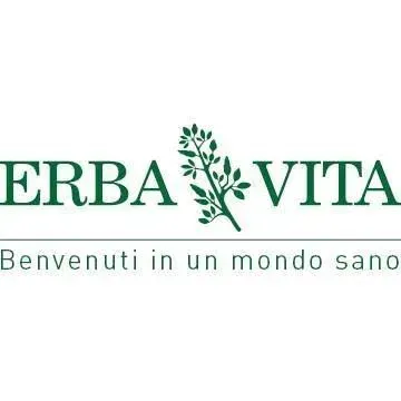 Logo verde “ERBA VITA” con ramo stilizzato e motto “Benvenuti in un mondo sano”