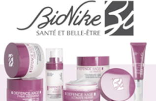 Prodotti per la cura della pelle BioNike con confezione e logo rosa su sfondo bianco.
