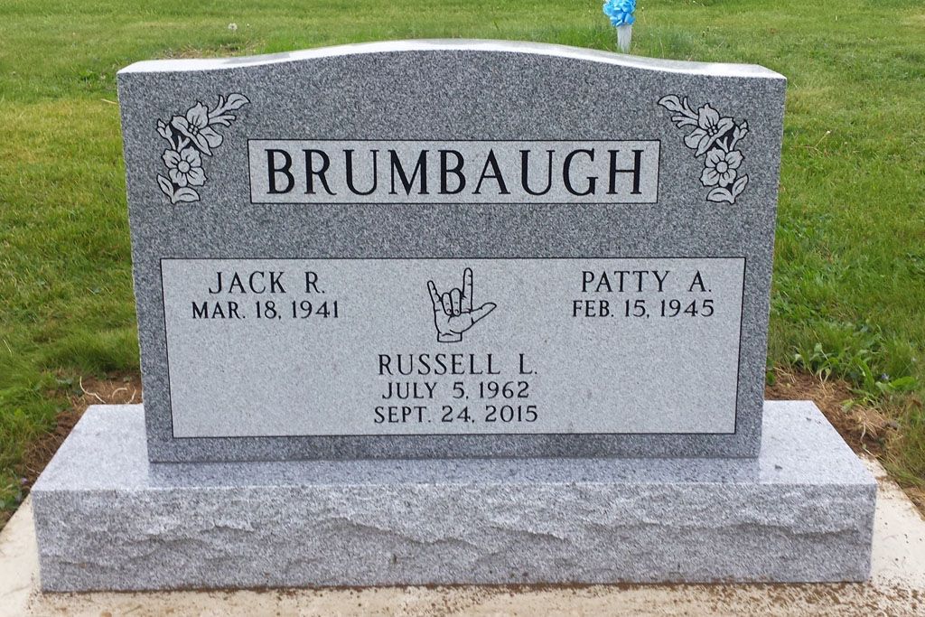 Gray Brumbaugh family gravestone with engraved names and dates in a cemetery