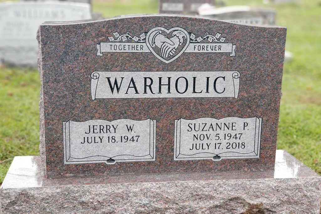 Warholic gravestone with two name plaques in a cemetery