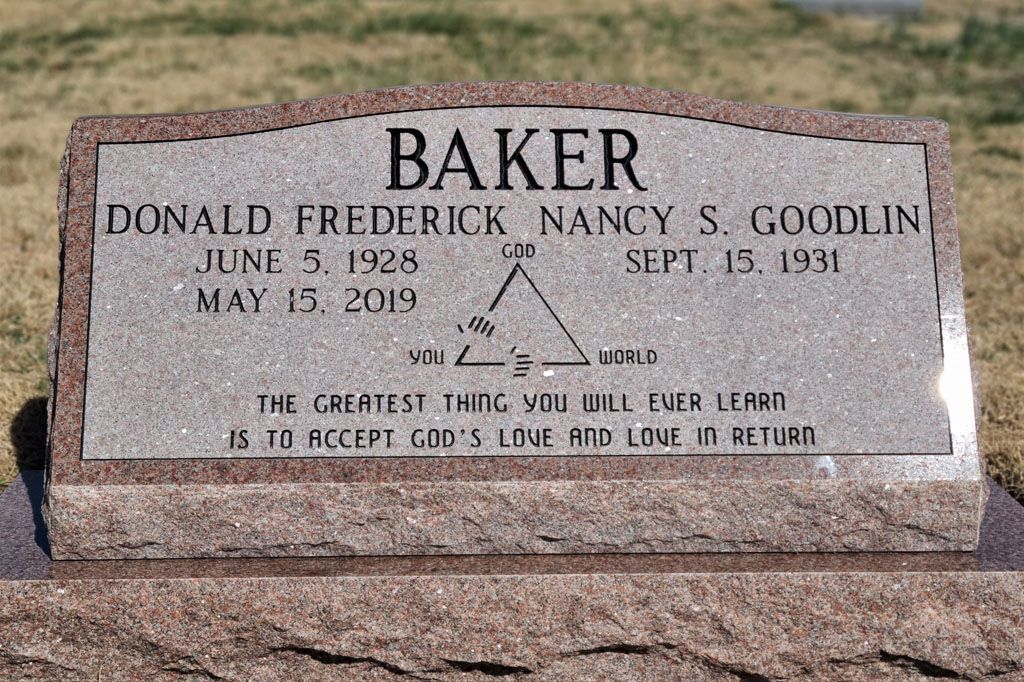 Baker family gravestone with engraved names and dates on a pink stone marker outdoors