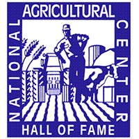 A blue and white logo for the National Agricultural Center and Hall of Fame, featuring a farmer, tractor, and cow.
