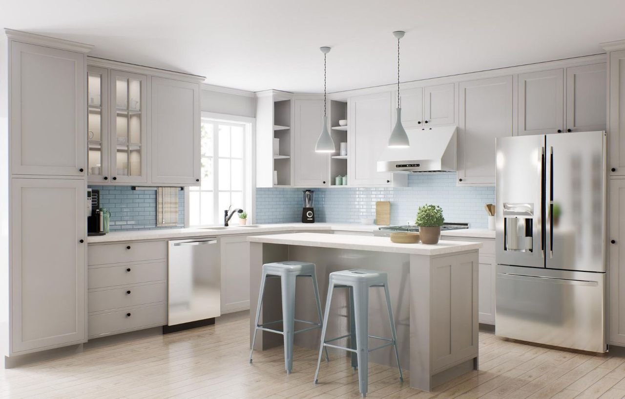 A Kitchen With White Cabinets, Stainless Steel Appliances, And A Large Island