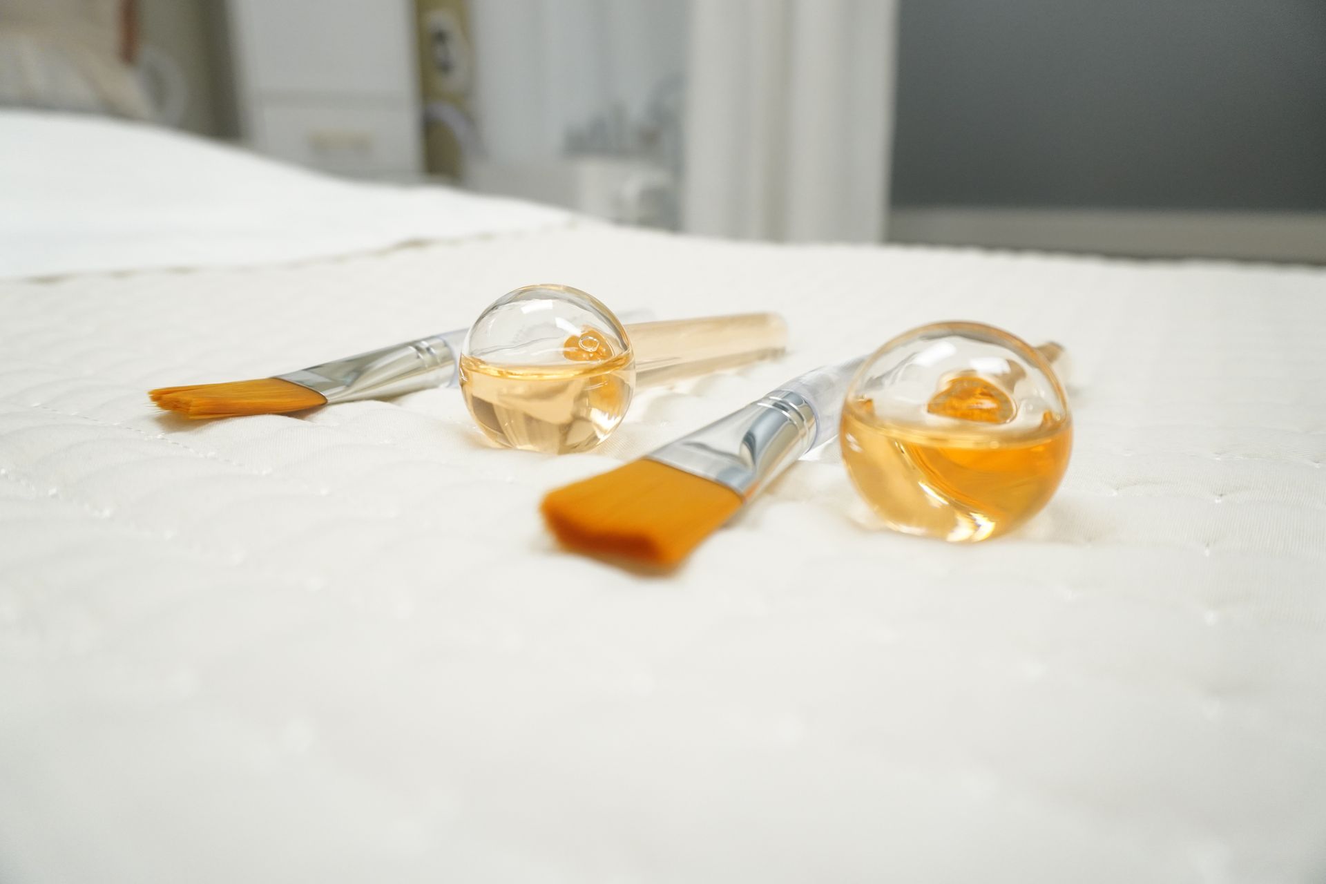 A couple of brushes sitting on top of a white towel.