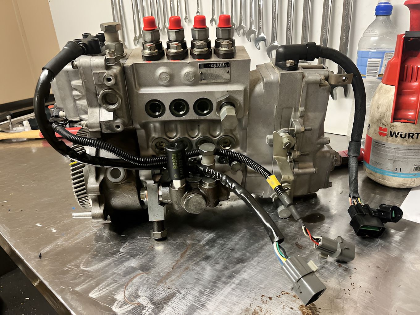 A Fuel Pump Is Sitting On Top Of A Metal Table — AMC Diesel Fuel Injection Services In Paget, QLD