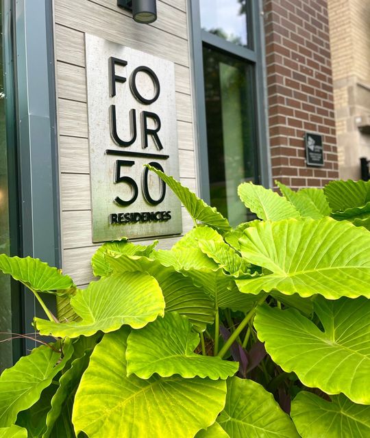 A sign on the side of a building that says four 50 residences