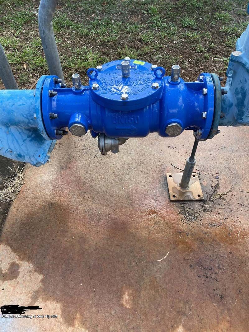 Blue Water Meter on Concrete, Connected to Blue Pipes, Outdoors — Full On Plumbing & Gas in Winnellie, NT