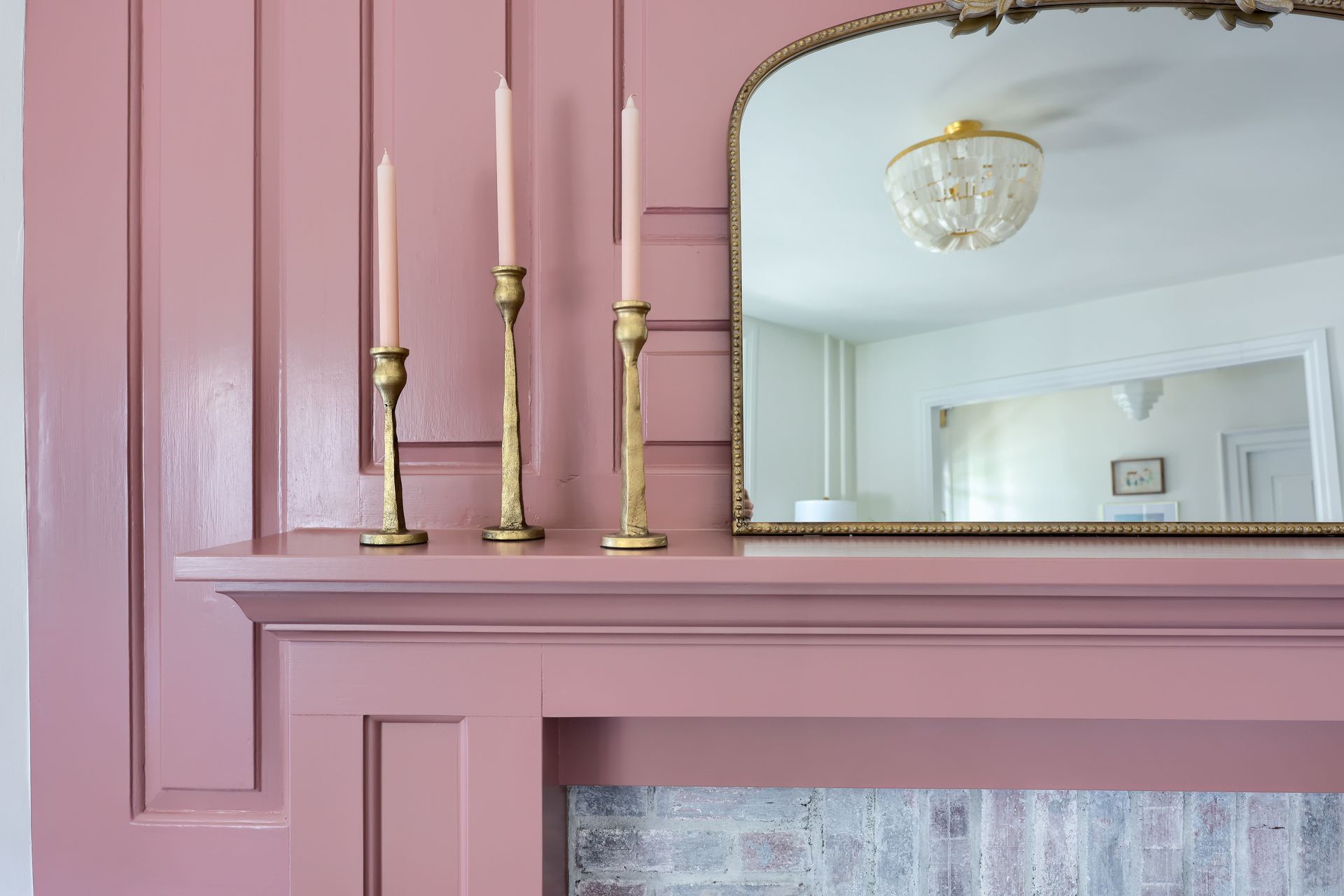 Custom Pink Fireplace and Gold Candlesticks
