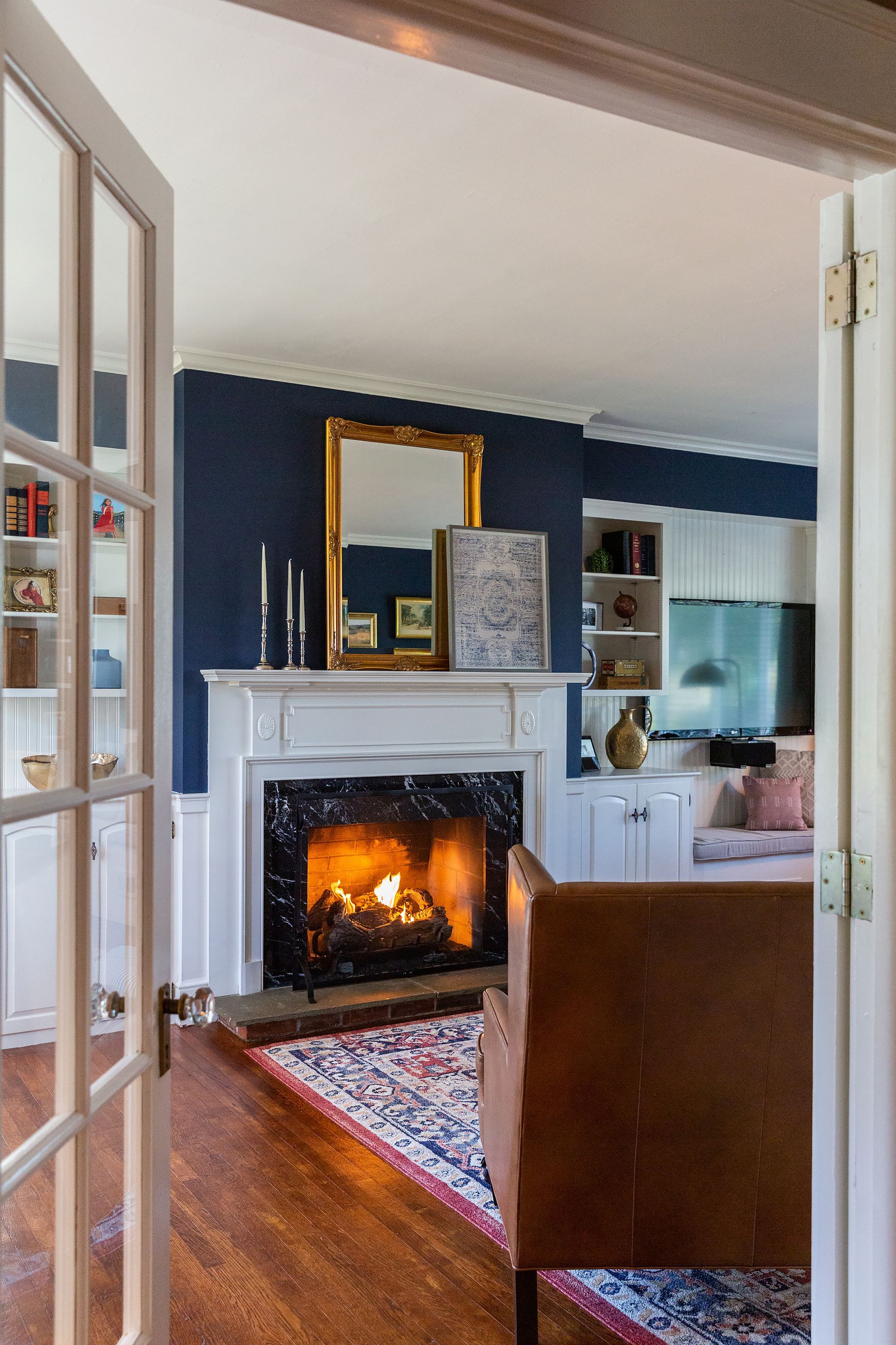 A living room with a fireplace and a couch
