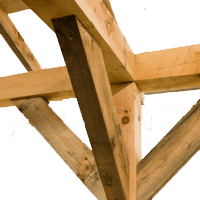 Wooden timber framing with angled support beams and a vertical post.